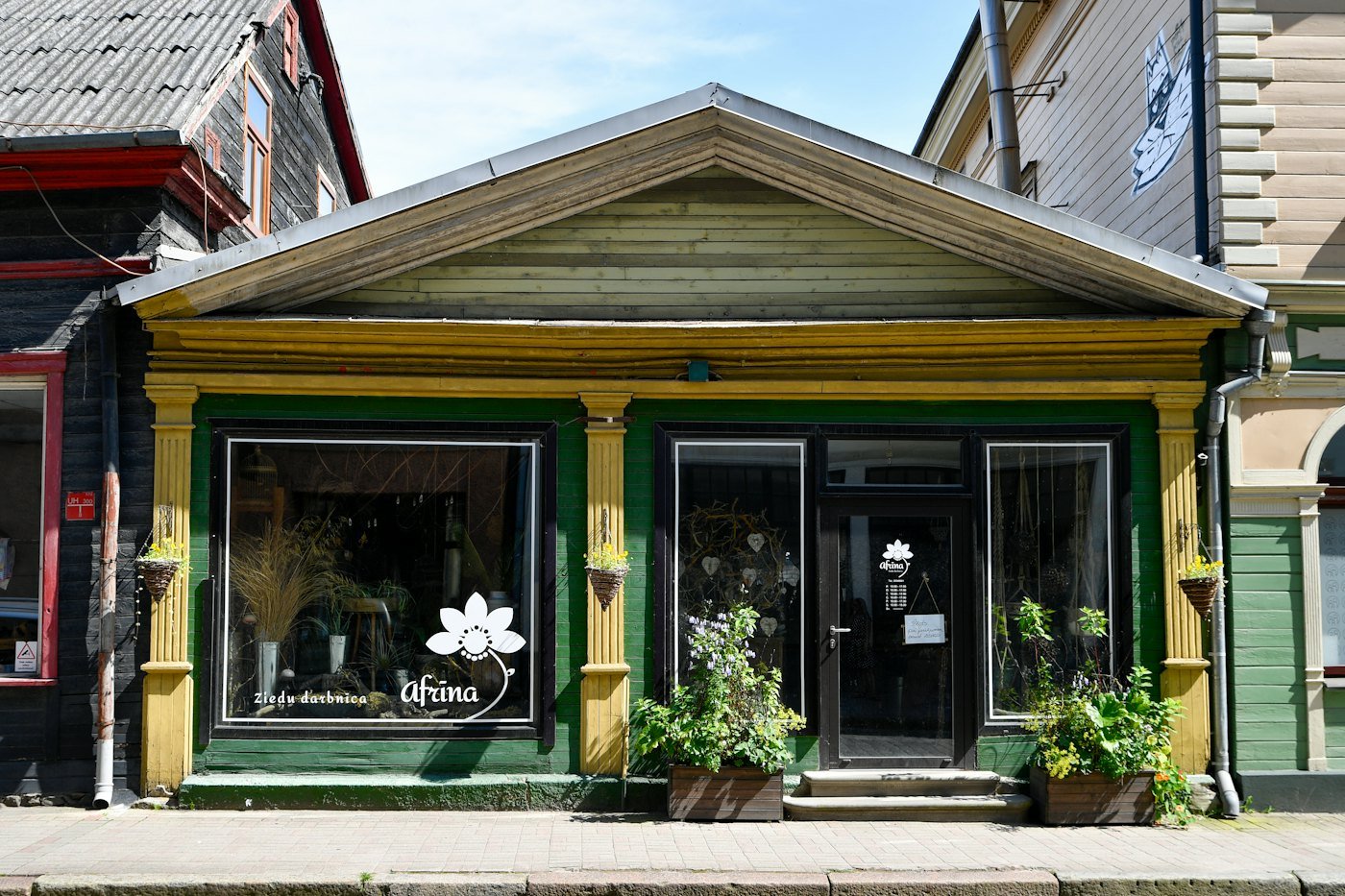 Placeholder stock photo: small storefront with large untinted display windows